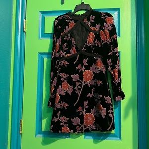 Zip up black forever 21 dress with chest cut out. Never been worn but no tags.